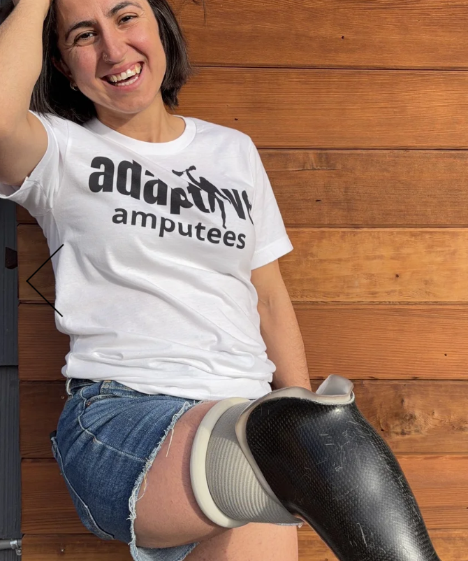 Founder Alex wears Adaptive Amputee logo